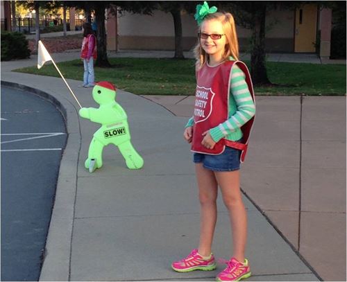 student wearing school safety patrol vest
